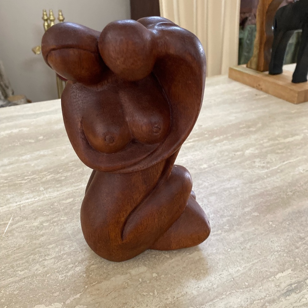 Stunning wood statue . Can be used as unique display in curio, collectible books